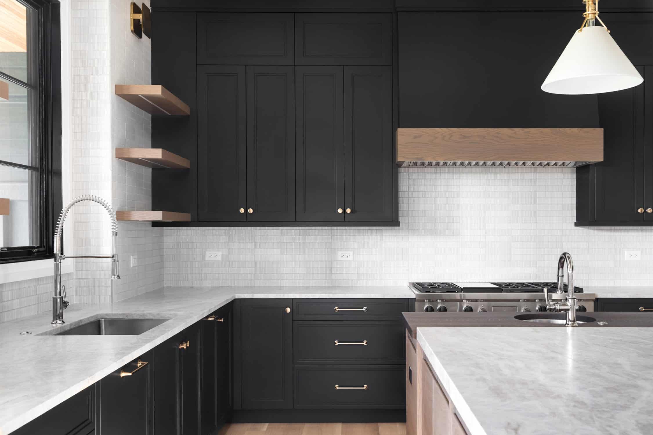 A black kitchen with stainless steel appliances. painting storage cabinet, Latest Color Palettes for Interiors