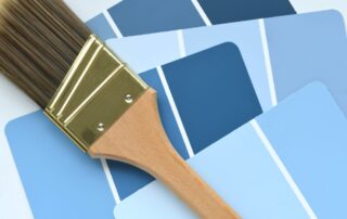 A brush on top of several blue color palette guides.